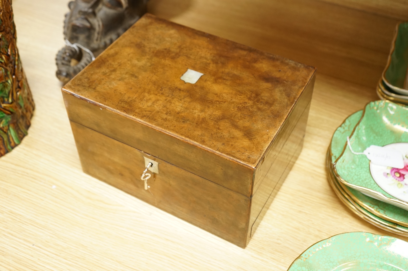 A 19th century walnut toilet box, fitted with glass and plate topped fittings, 27.5cm wide x 17cm high